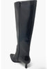 Black knee-high boot with a zipper on a white background